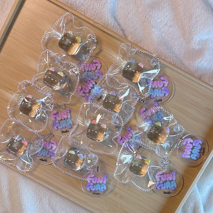 20g 透明ミニミルクキャンディねこスクイーズ（キーホルダー対応）｜飴みたいな透けツヤ感の手作りデザインで、バッグや鍵にちょこんと付けて持ち歩ける｜ストレス解消｜濃厚でねっとりした“泥感”クレイ触感